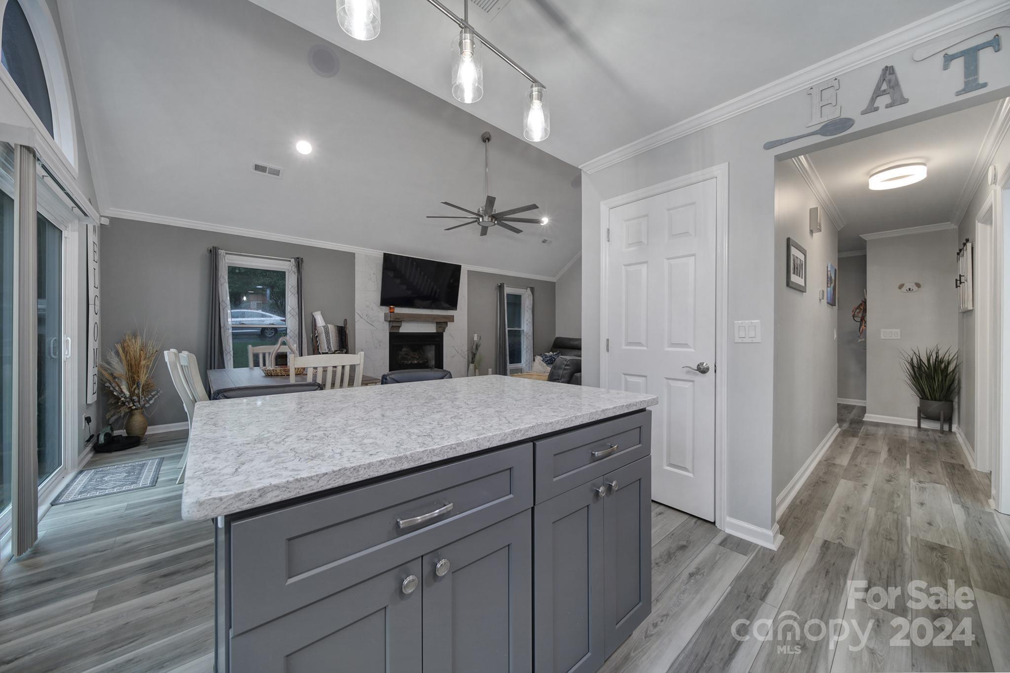 9119 Windjammer Drive Tega Cay, SC 29708 - Photo 8 of 40 a bathroom with a granite countertop sink a mirror and shower