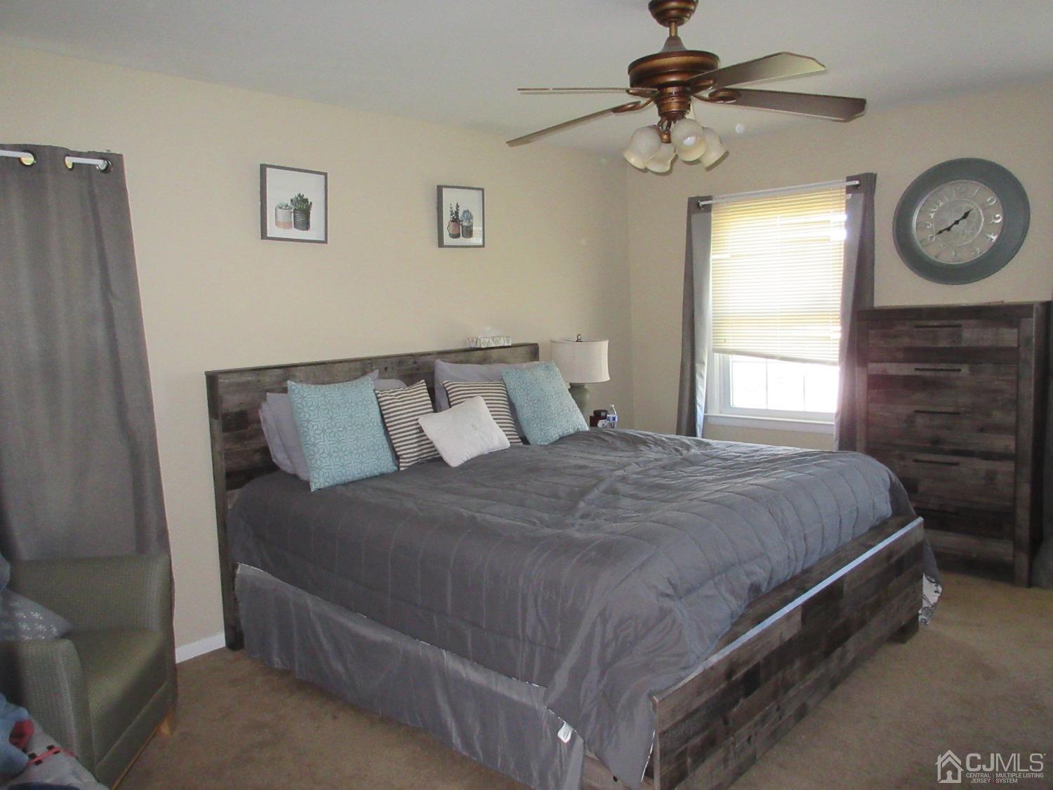 406 Chestnut Street Middlesex, NJ 08846 - Photo 14 of 16 a bedroom with a bed and a window