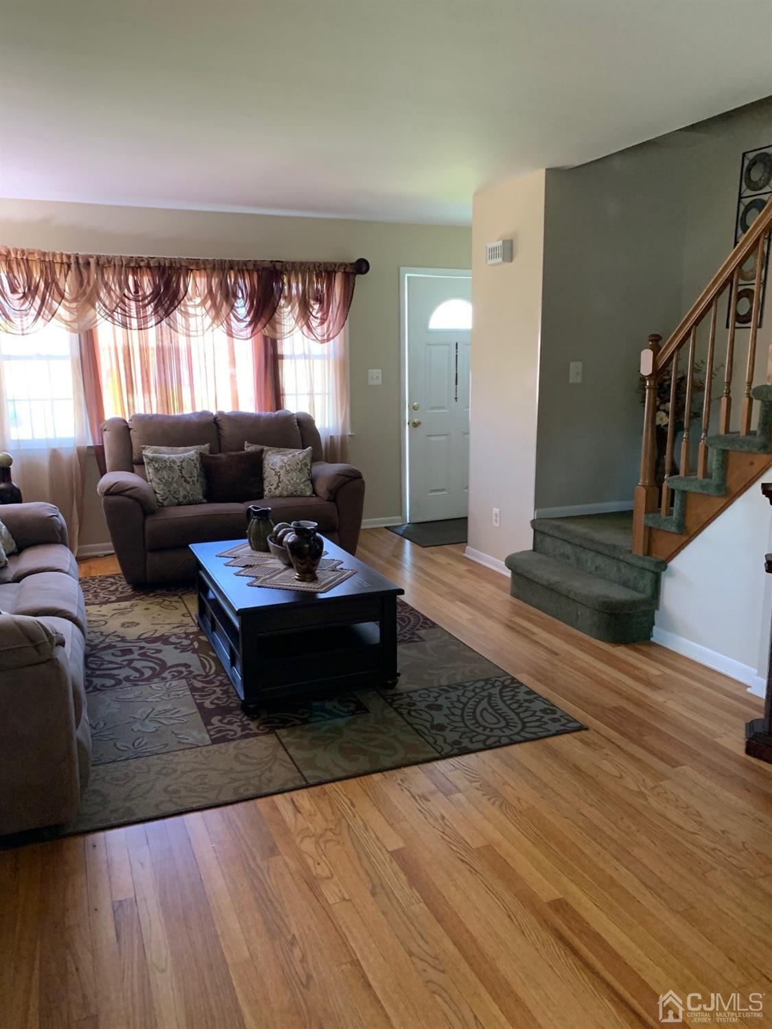 406 Chestnut Street Middlesex, NJ 08846 - Photo 3 of 16 a living room with furniture and a large window