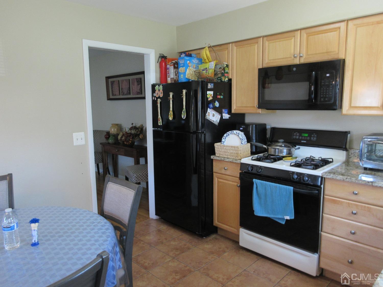 406 Chestnut Street Middlesex, NJ 08846 - Photo 6 of 16 a kitchen with a stove and a refrigerator
