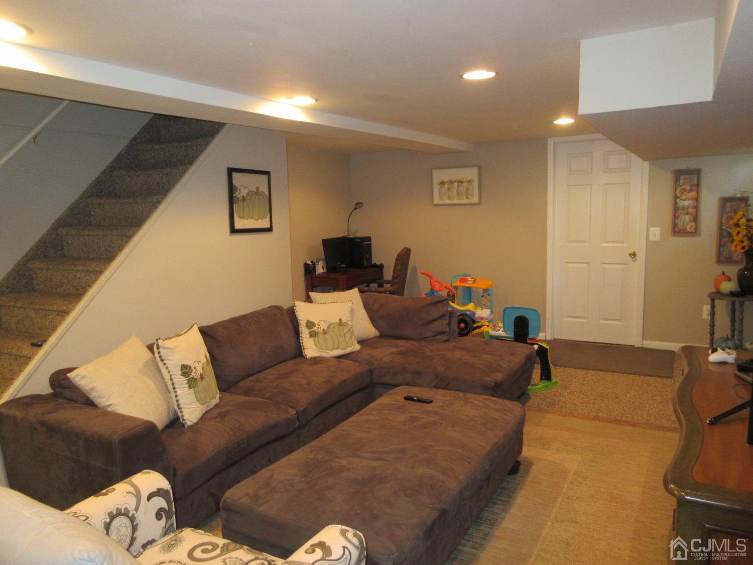406 Chestnut Street Middlesex, NJ 08846 - Photo 8 of 16 a living room with furniture and a couch