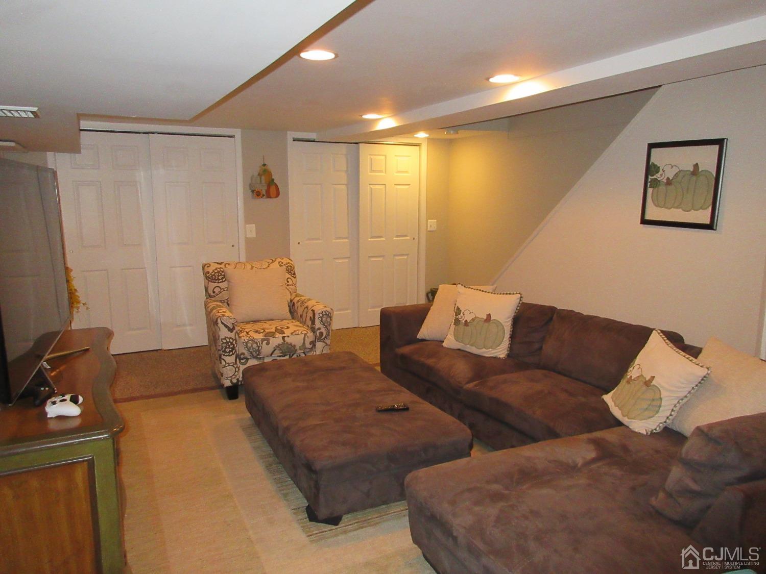 406 Chestnut Street Middlesex, NJ 08846 - Photo 9 of 16 a living room with furniture and a flat screen tv