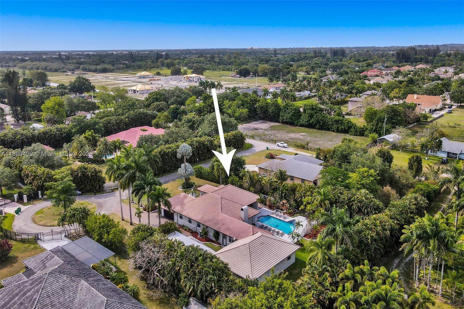 3152 Southwest 147th Avenue Davie, FL 33330 - Photo 13 of 38 an aerial view of residential houses with outdoor space and trees