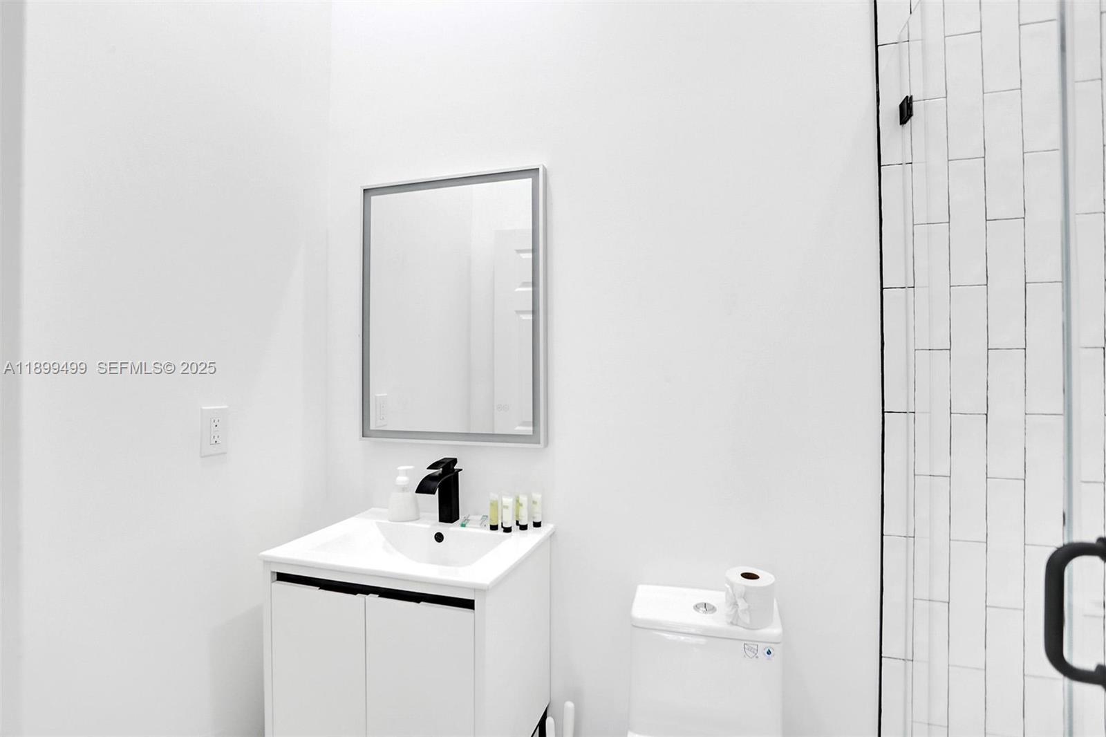 3152 Southwest 147th Avenue Davie, FL 33330 - Photo 17 of 38 a bathroom with a sink a toilet and shower