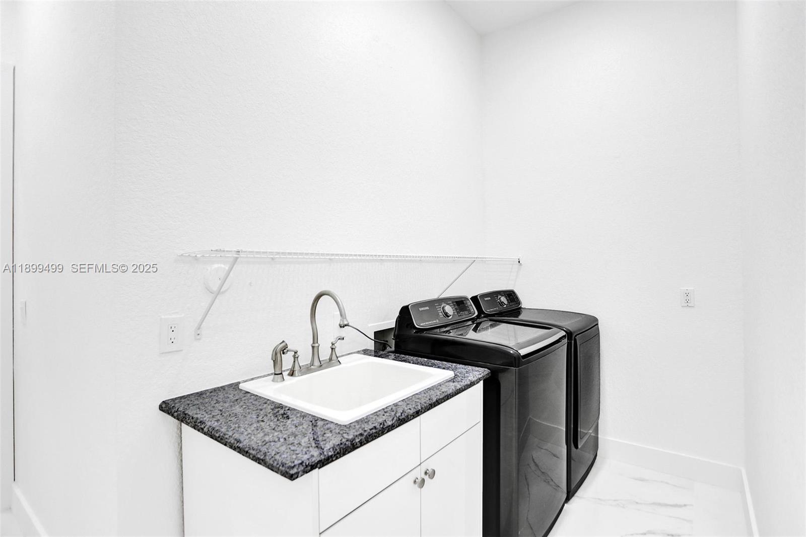 3152 Southwest 147th Avenue Davie, FL 33330 - Photo 18 of 38 a bathroom with a granite countertop sink and a mirror
