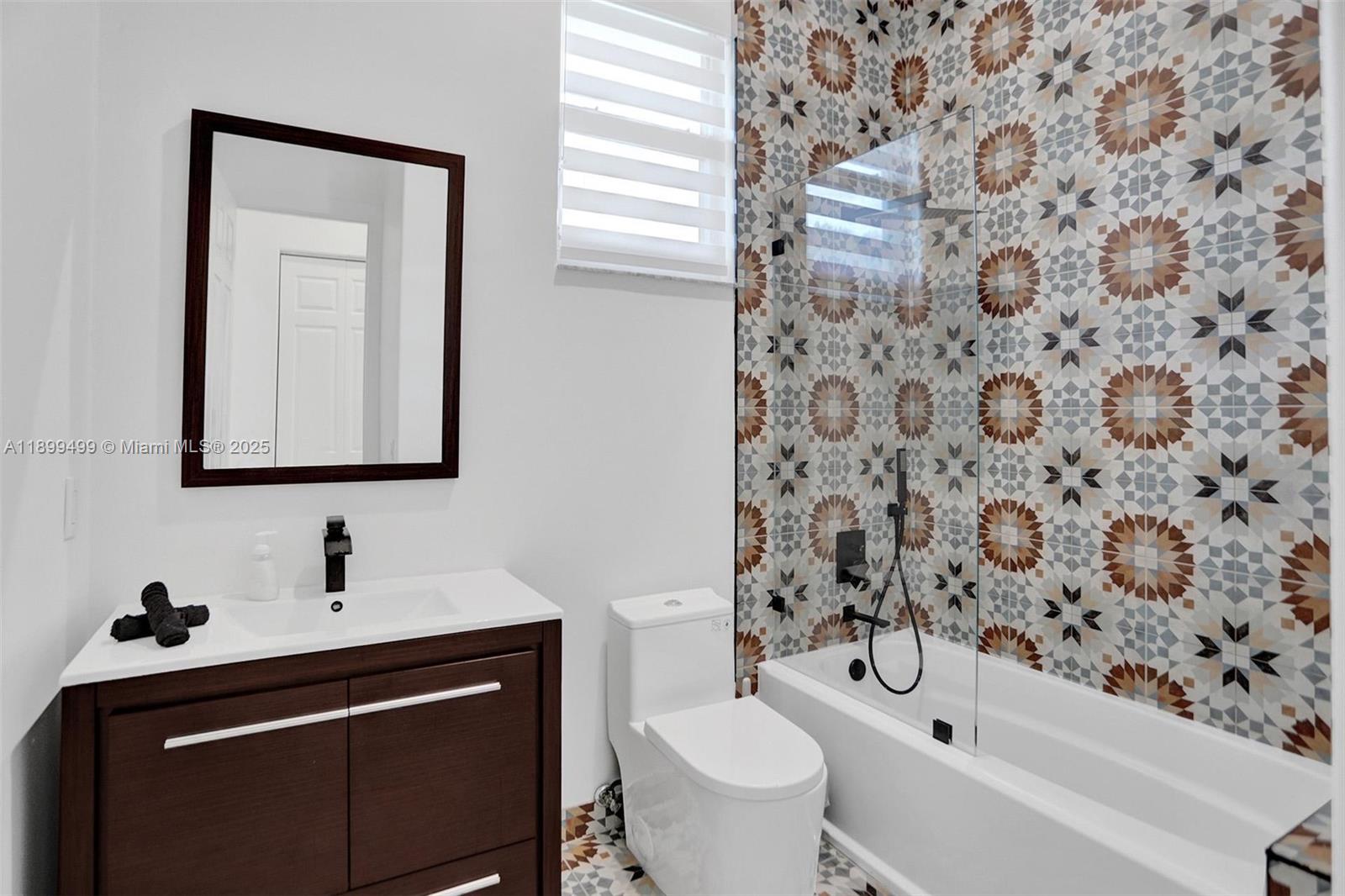 3152 Southwest 147th Avenue Davie, FL 33330 - Photo 27 of 38 a bathroom with a sink toilet and shower