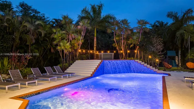 swimming pool with patio outdoor seating and yard