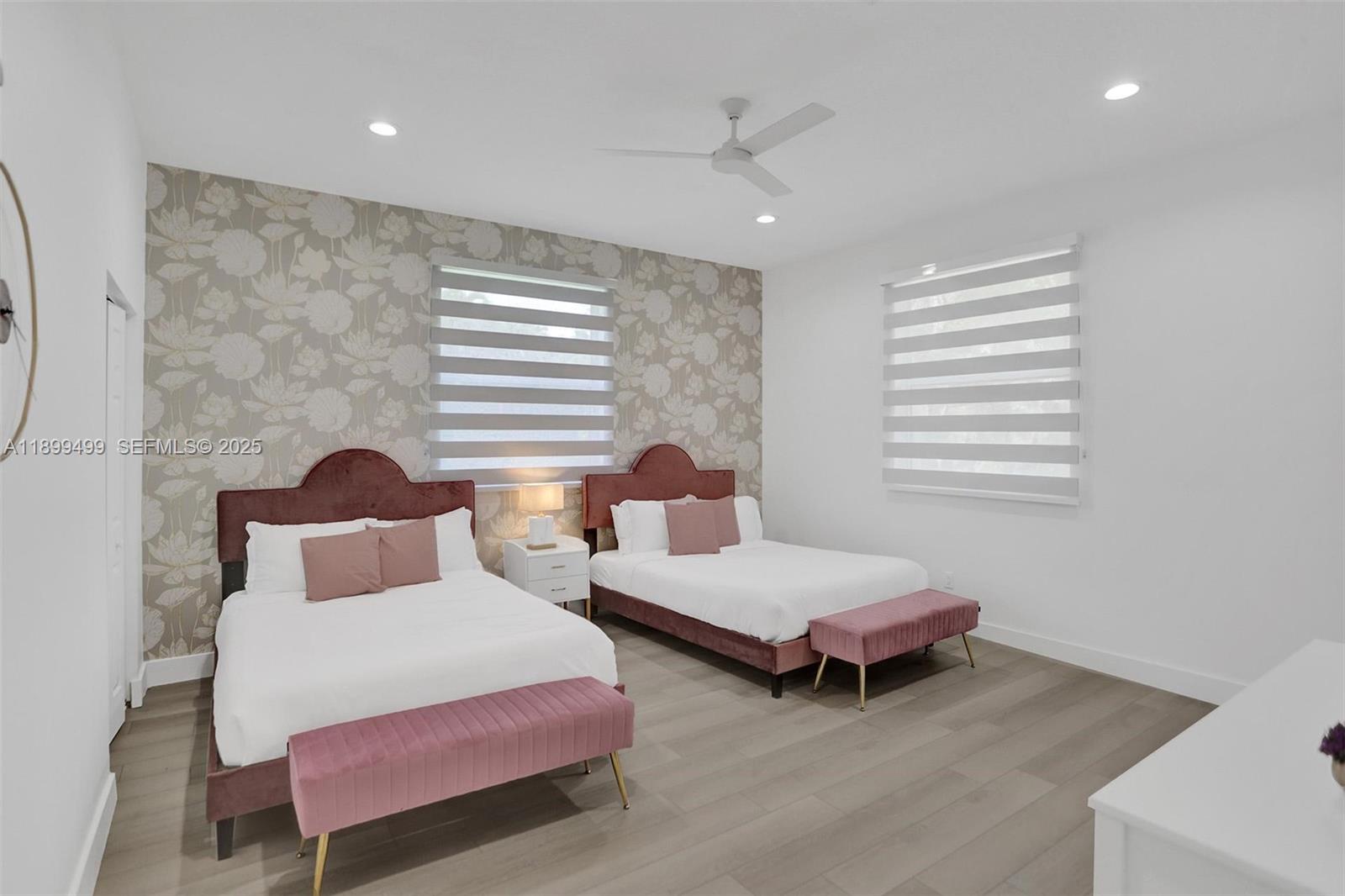 3152 Southwest 147th Avenue Davie, FL 33330 - Photo 31 of 38 a bedroom with two beds and a chandelier