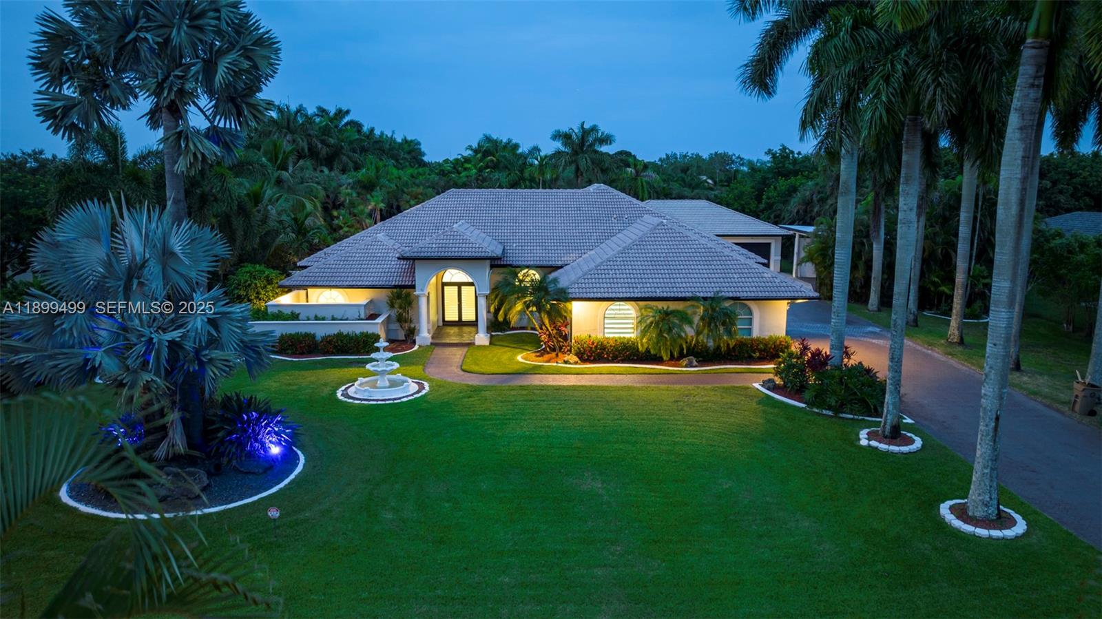 3152 Southwest 147th Avenue Davie, FL 33330 - Photo 6 of 38 a view of backyard with table and chairs and a fire pit