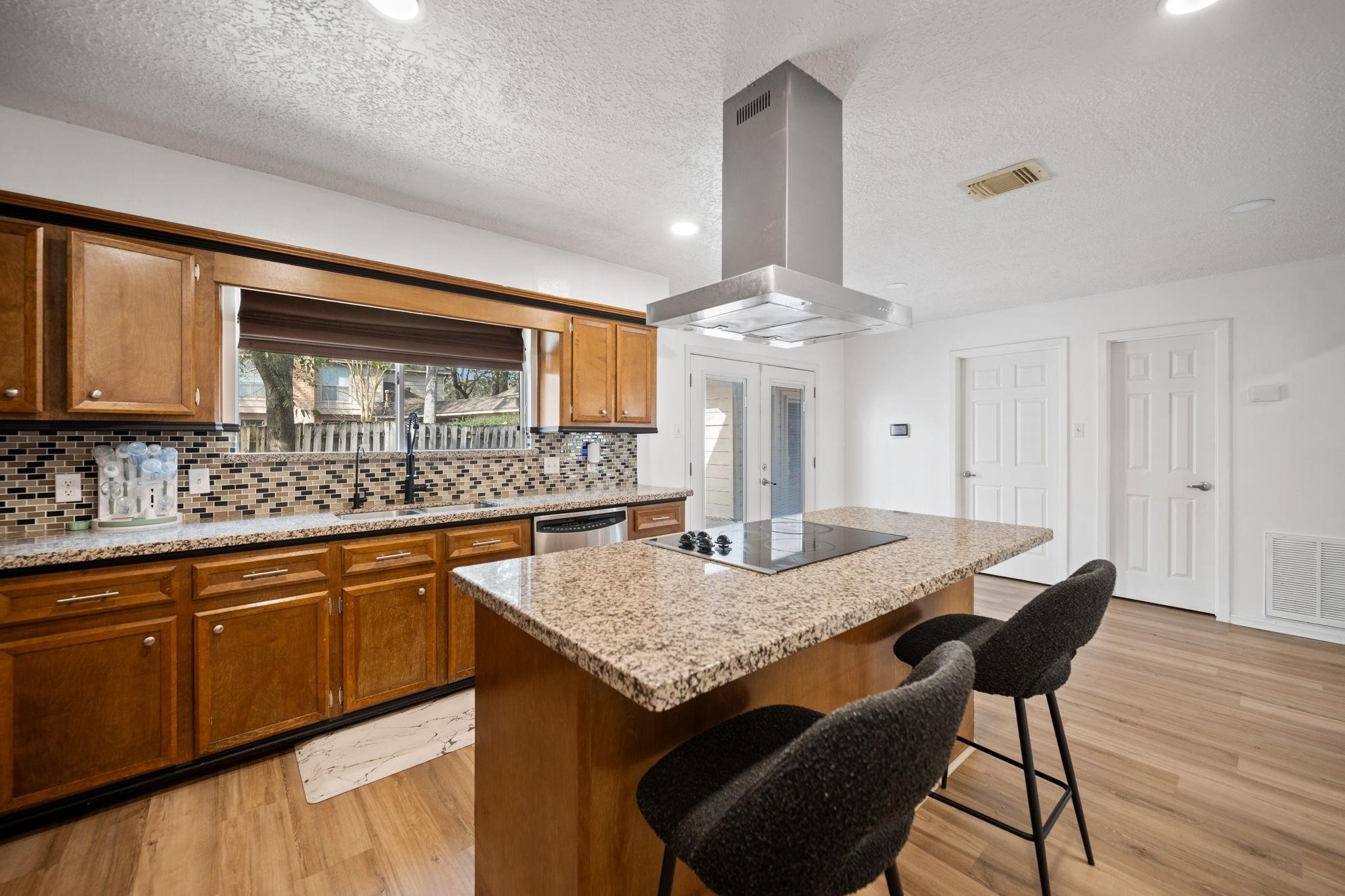 14907 Oak Bluff Court Houston, TX 77070 - Photo 7 of 19 Large center island with seating and prep space