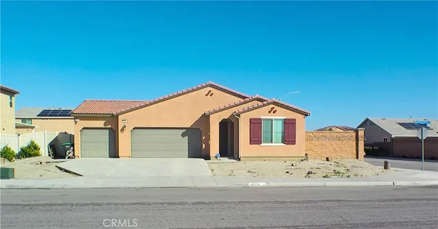 a view of a house with a yard and garage