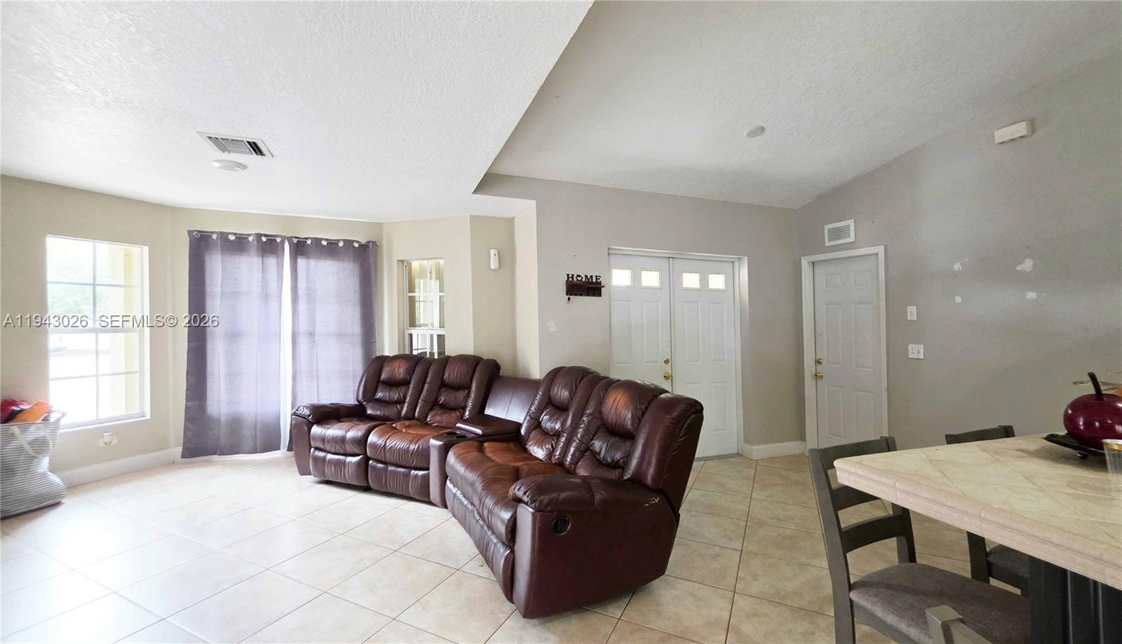 355 North Lindero Street Clewiston, FL 33440 - Photo 19 of 30 a living room with furniture window and a table