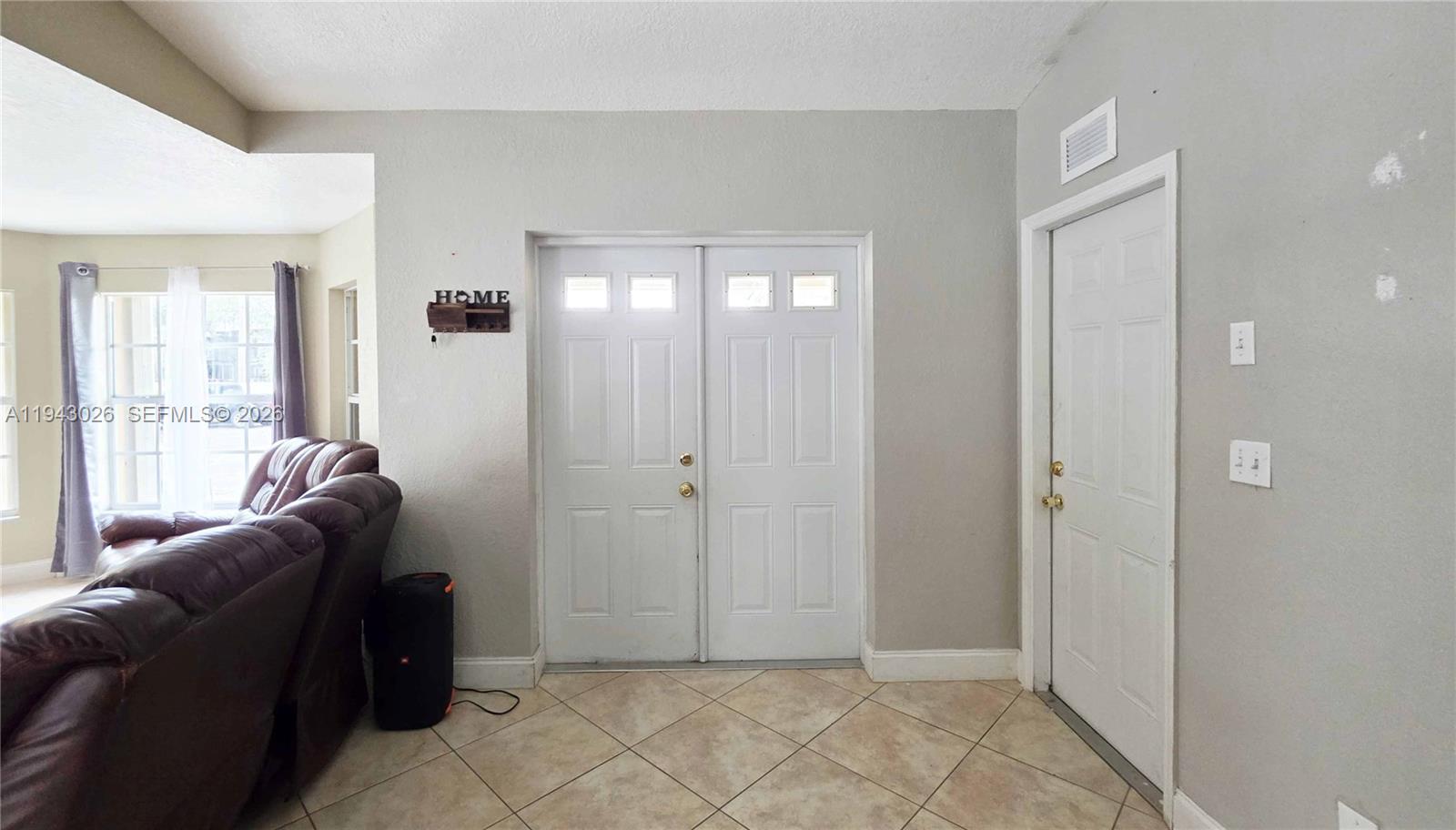 355 North Lindero Street Clewiston, FL 33440 - Photo 20 of 30 a living room with furniture and a window