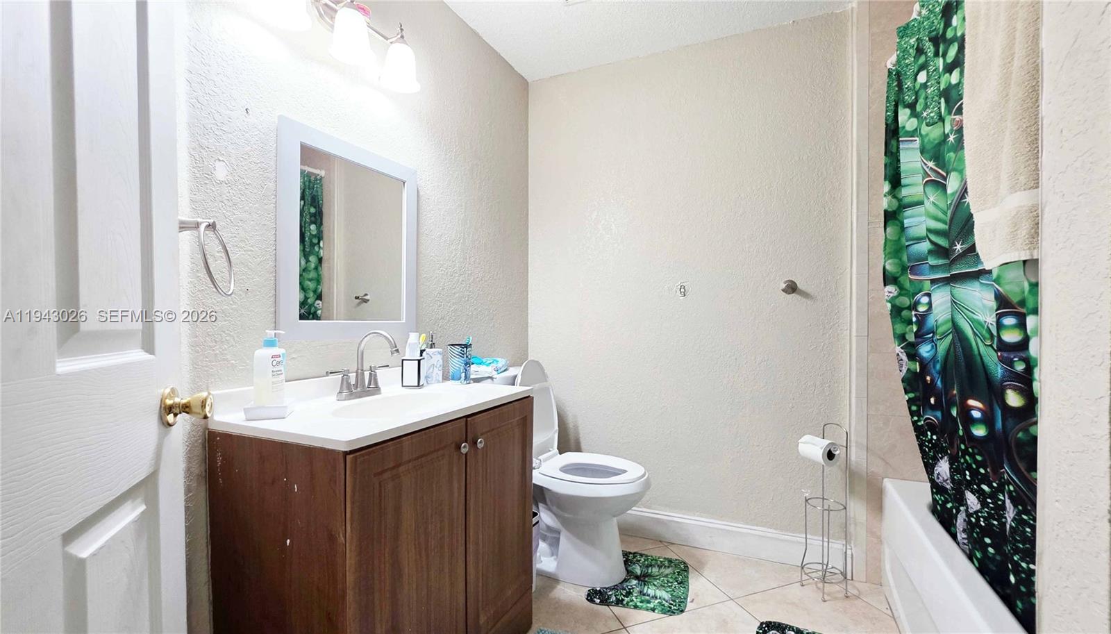 355 North Lindero Street Clewiston, FL 33440 - Photo 24 of 30 a bathroom with a sink toilet and shower