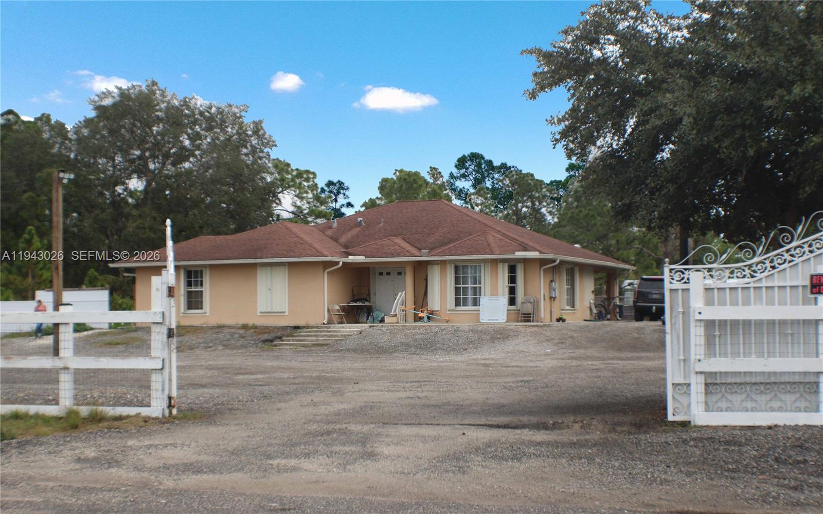 355 North Lindero Street Clewiston, FL 33440 - Photo 5 of 30 a front view of a house with a porch