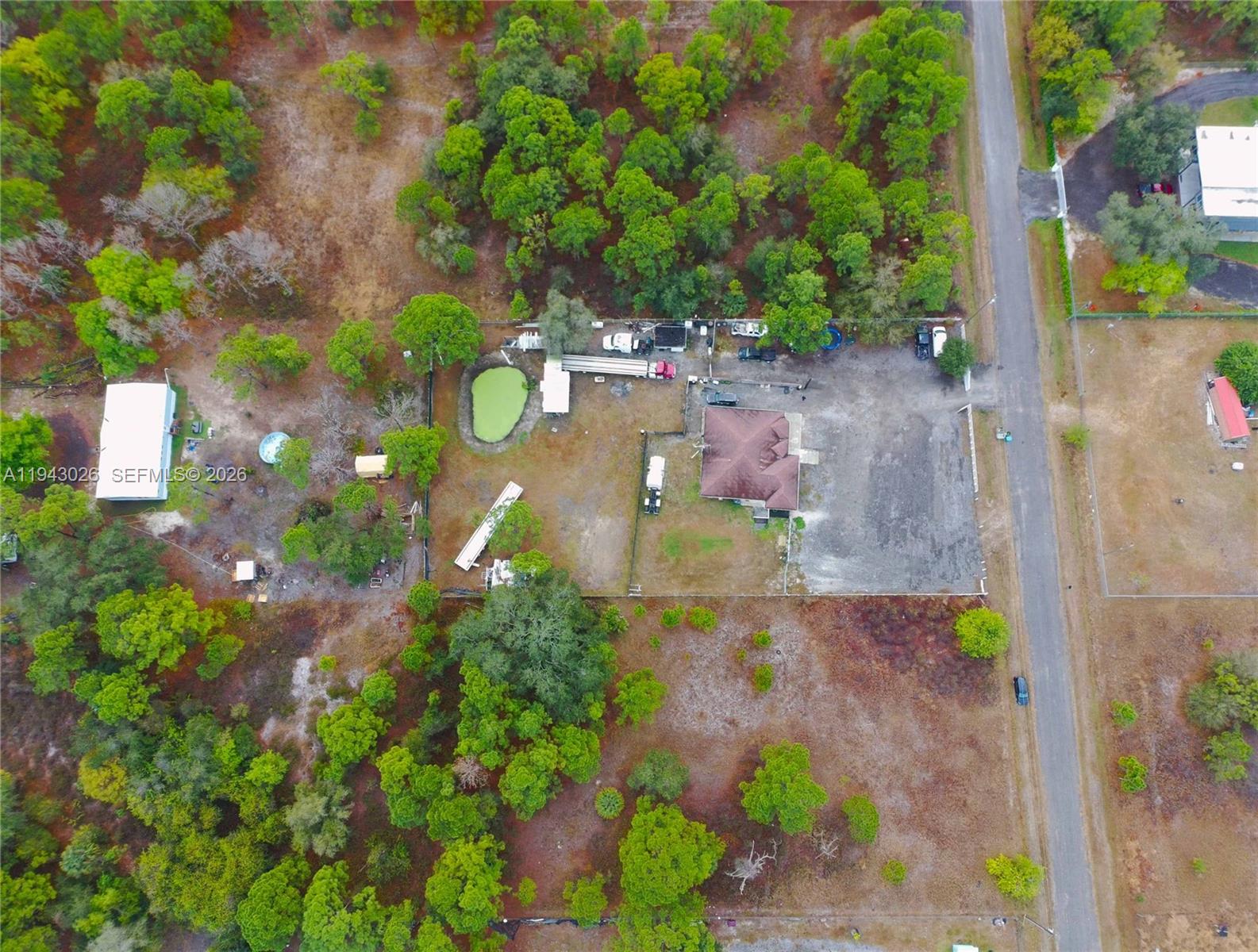 355 North Lindero Street Clewiston, FL 33440 - Photo 7 of 30 a view of a yard with plants