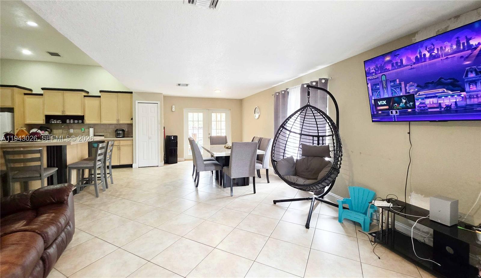 355 North Lindero Street Clewiston, FL 33440 - Photo 8 of 30 a living room with furniture a air conditioner and a table
