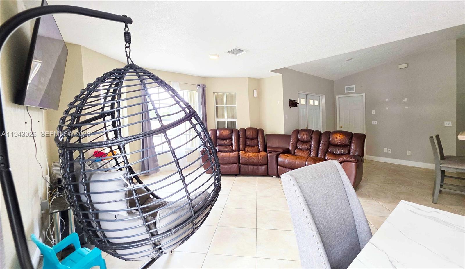 355 North Lindero Street Clewiston, FL 33440 - Photo 10 of 30 a living room with furniture and a wooden floor