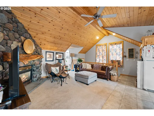 a living room with furniture a rug and a fireplace