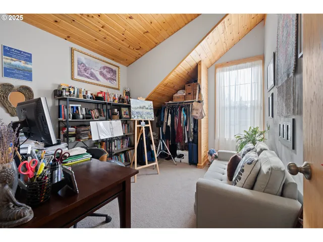a living room with lots of furniture and a flat screen tv