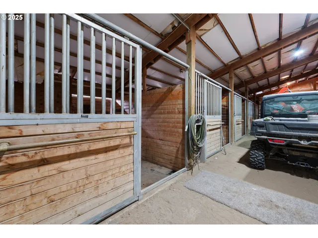 a view of walk in closet with clothes