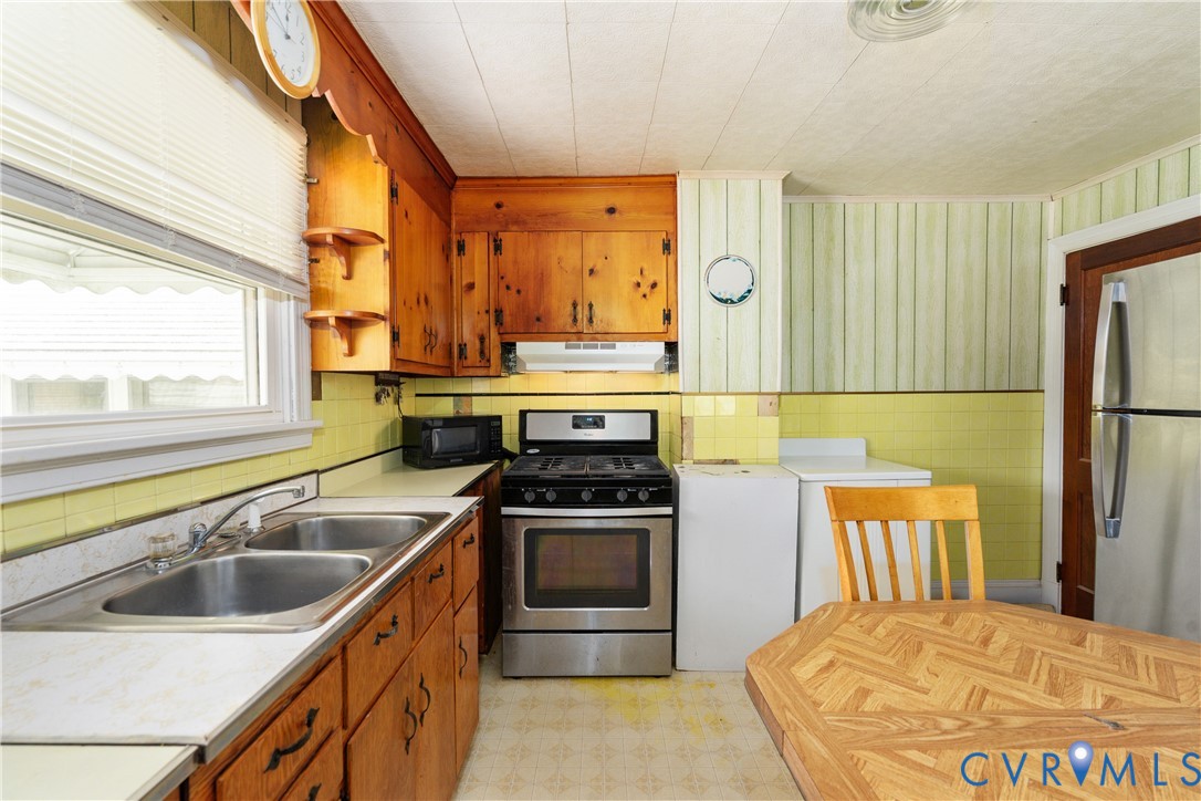 4000 Wayside Road Charles City, VA 23030 - Photo 17 of 30 Kitchen featuring wood cabinetry, a double basin s
