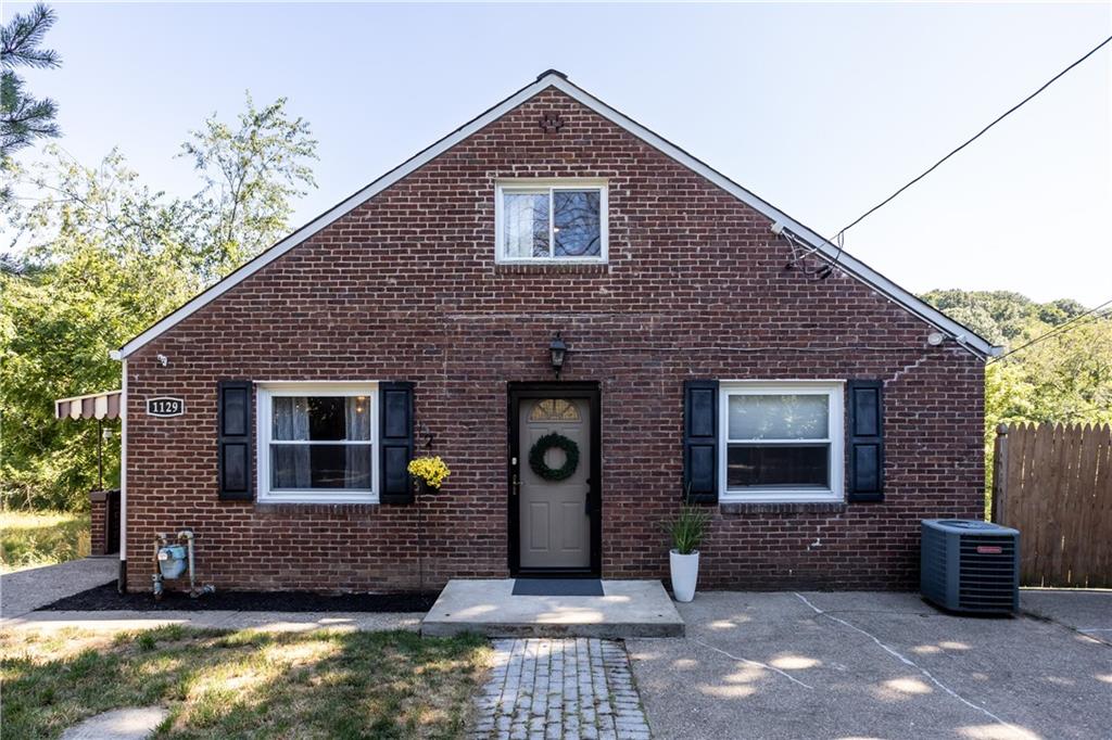 1129 Edith Avenue Pittsburgh, PA 15236 - Photo 1 of 25 a front view of a house with glass windows
