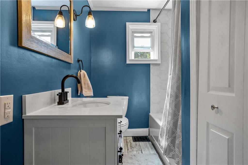 1129 Edith Avenue Pittsburgh, PA 15236 - Photo 17 of 25 a bathroom with a sink toilet and mirror