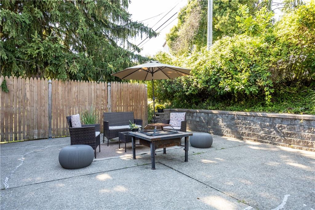 1129 Edith Avenue Pittsburgh, PA 15236 - Photo 21 of 25 a backyard view of a house with table and chairs