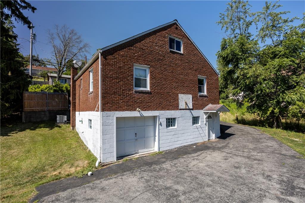 1129 Edith Avenue Pittsburgh, PA 15236 - Photo 24 of 25 a view of a house with a yard