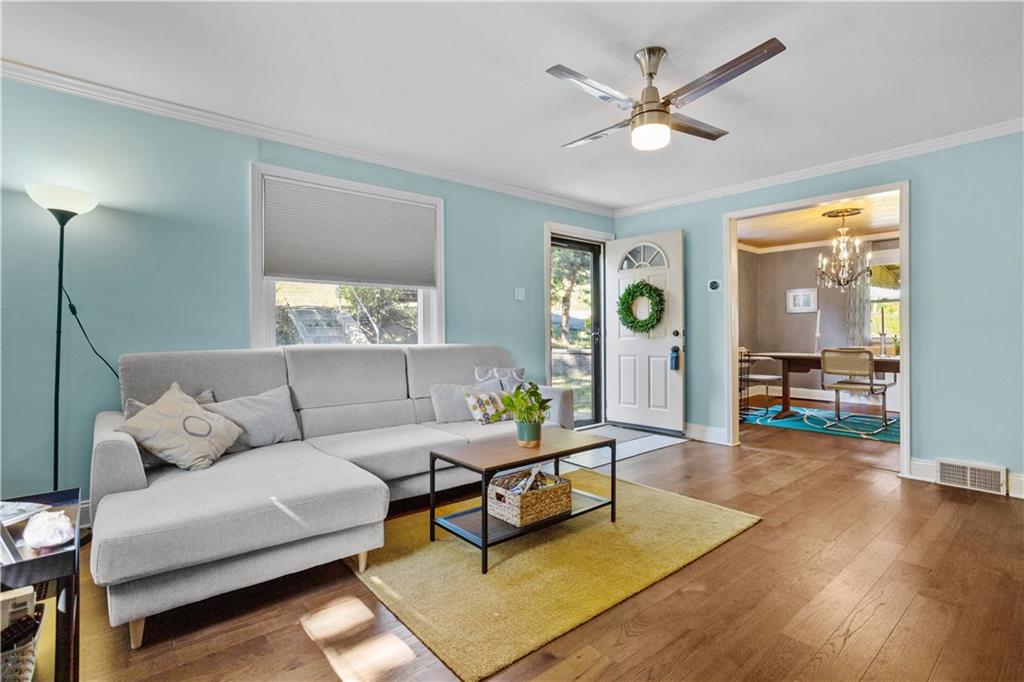 1129 Edith Avenue Pittsburgh, PA 15236 - Photo 3 of 25 a living room with furniture and wooden floor