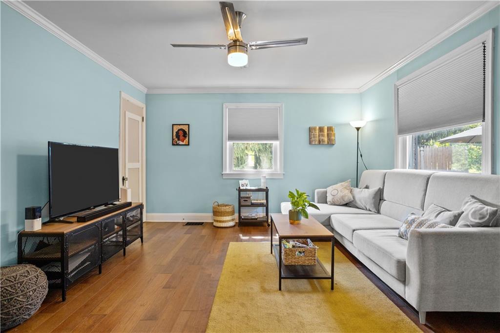 1129 Edith Avenue Pittsburgh, PA 15236 - Photo 4 of 25 a living room with furniture and a flat screen tv