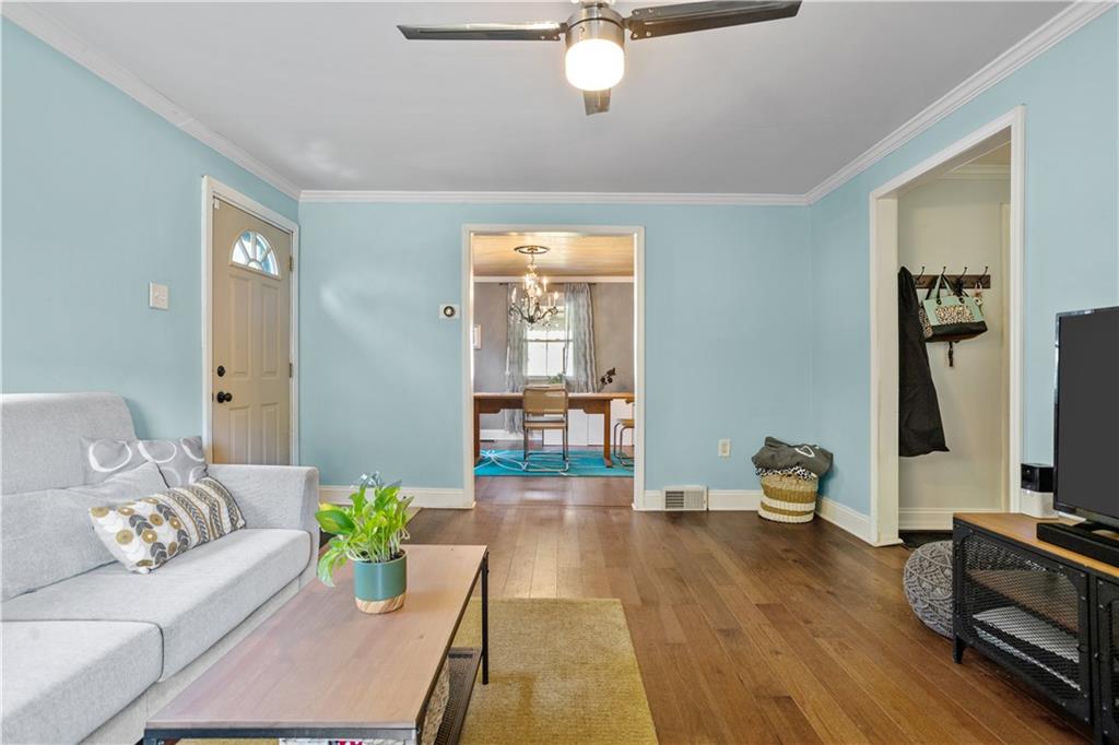 1129 Edith Avenue Pittsburgh, PA 15236 - Photo 6 of 25 a living room with furniture and a flat screen tv
