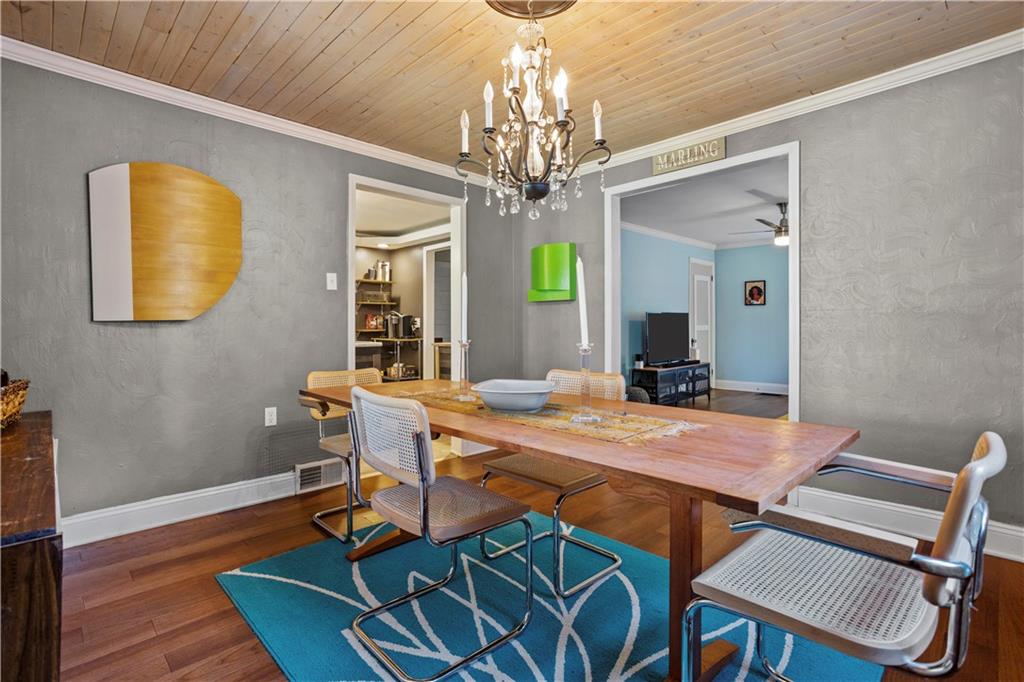 1129 Edith Avenue Pittsburgh, PA 15236 - Photo 8 of 25 a view of a dining room with furniture and a chandelier