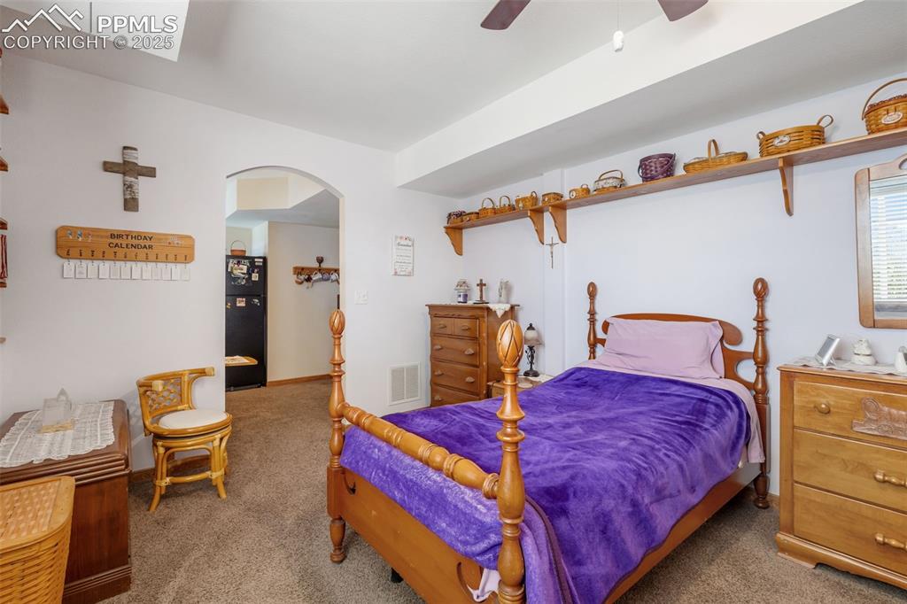 18895 Sage Crest Road Peyton, CO 80831 - Photo 28 of 38 a bedroom with bed and window