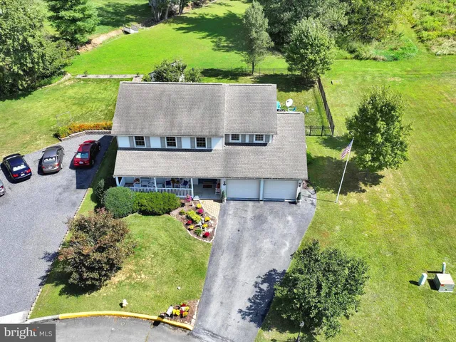 an aerial view of a house with a garden