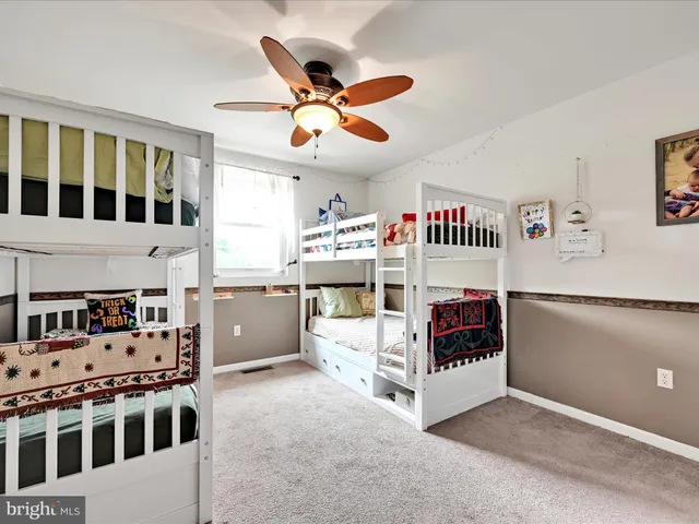 a view of a room with furniture and windows