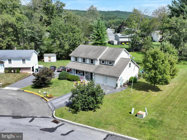 an aerial view of a house with garden