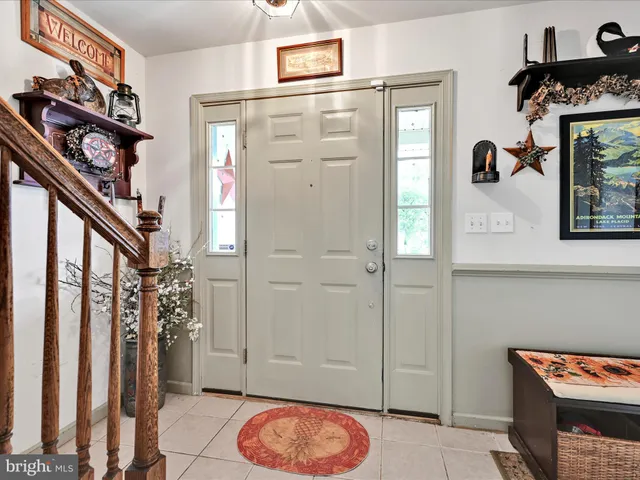 a view of an entryway with wooden floor