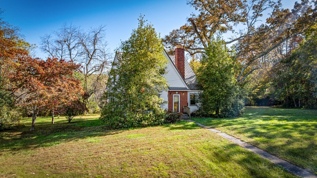 411 Old Highway 5 Blue Ridge, GA 30513 - Photo 3 of 45 a front view of a house with a yard