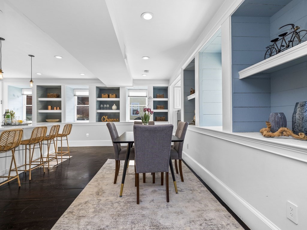 131 Centre Street Boston, MA 02124 - Photo 11 of 26 a view of a dining room with furniture and wooden floor