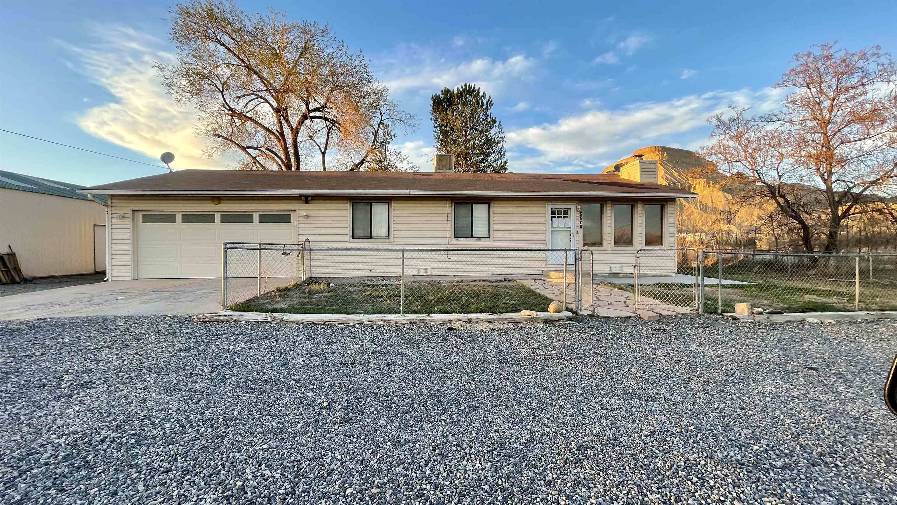 3374 G Road Clifton, CO 81520 - Photo 1 of 24 front view of a house with a yard