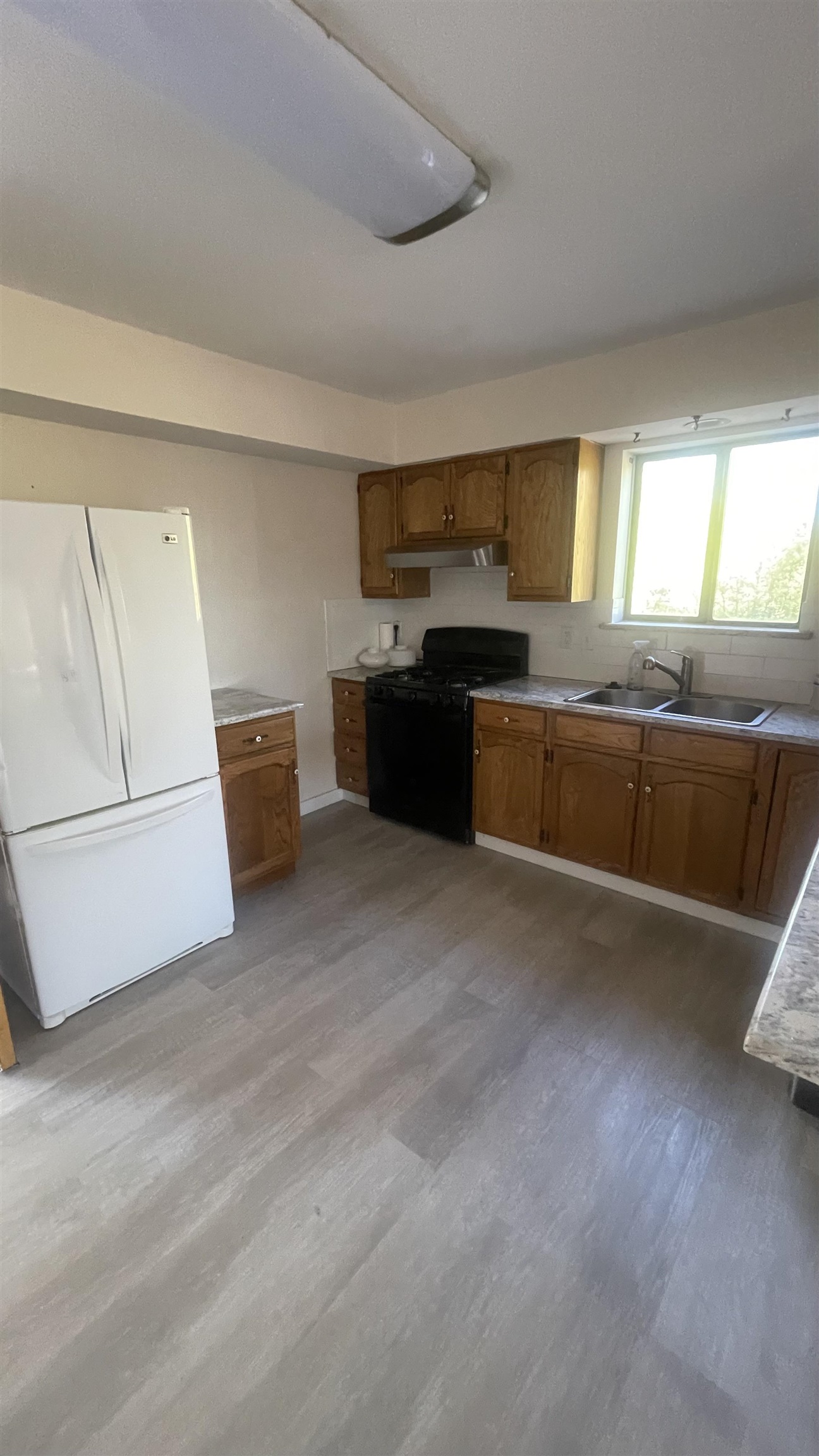 3374 G Road Clifton, CO 81520 - Photo 12 of 24 a large kitchen with a stove and a refrigerator