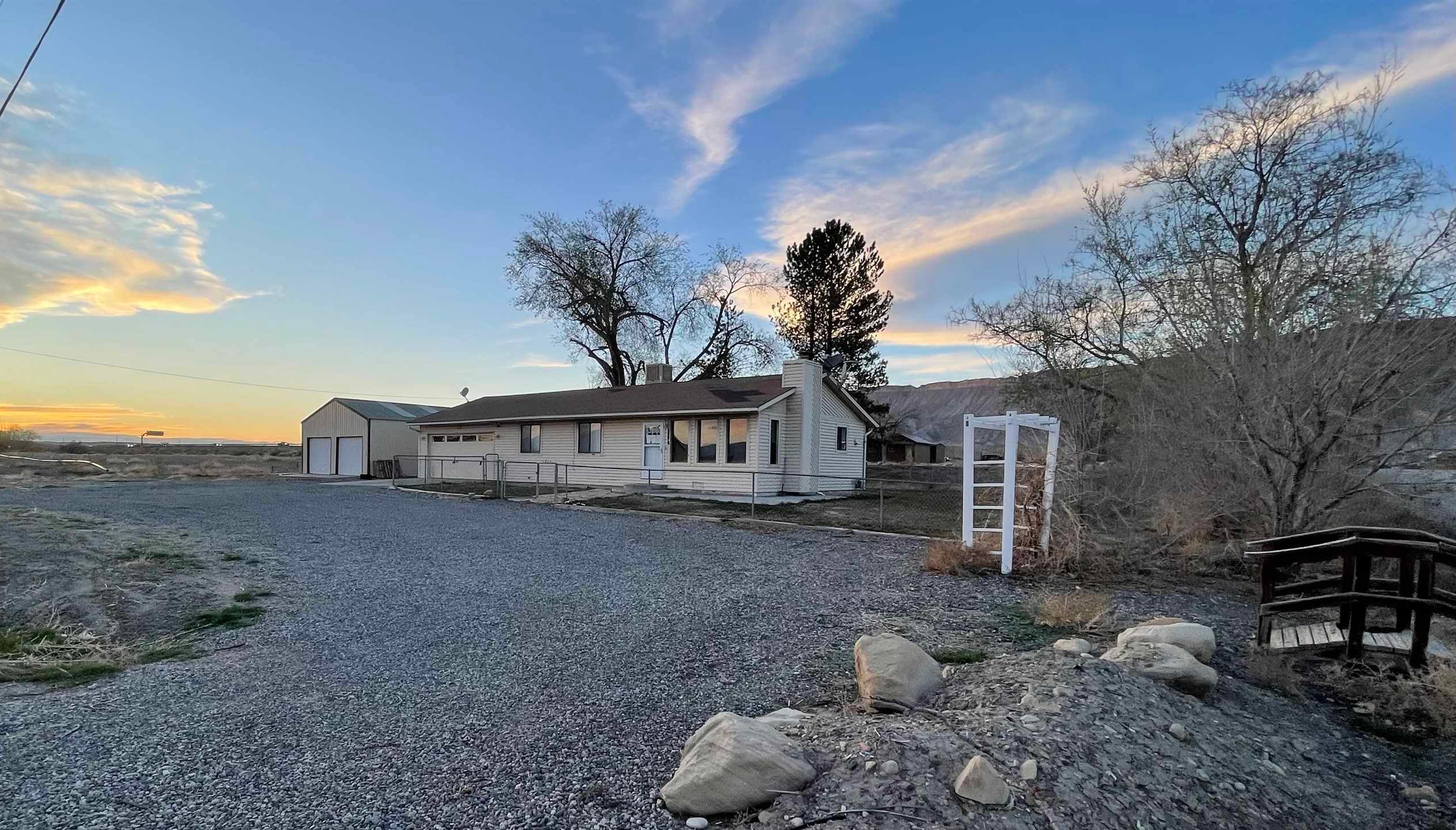 3374 G Road Clifton, CO 81520 - Photo 21 of 24 a front view of a house with a yard