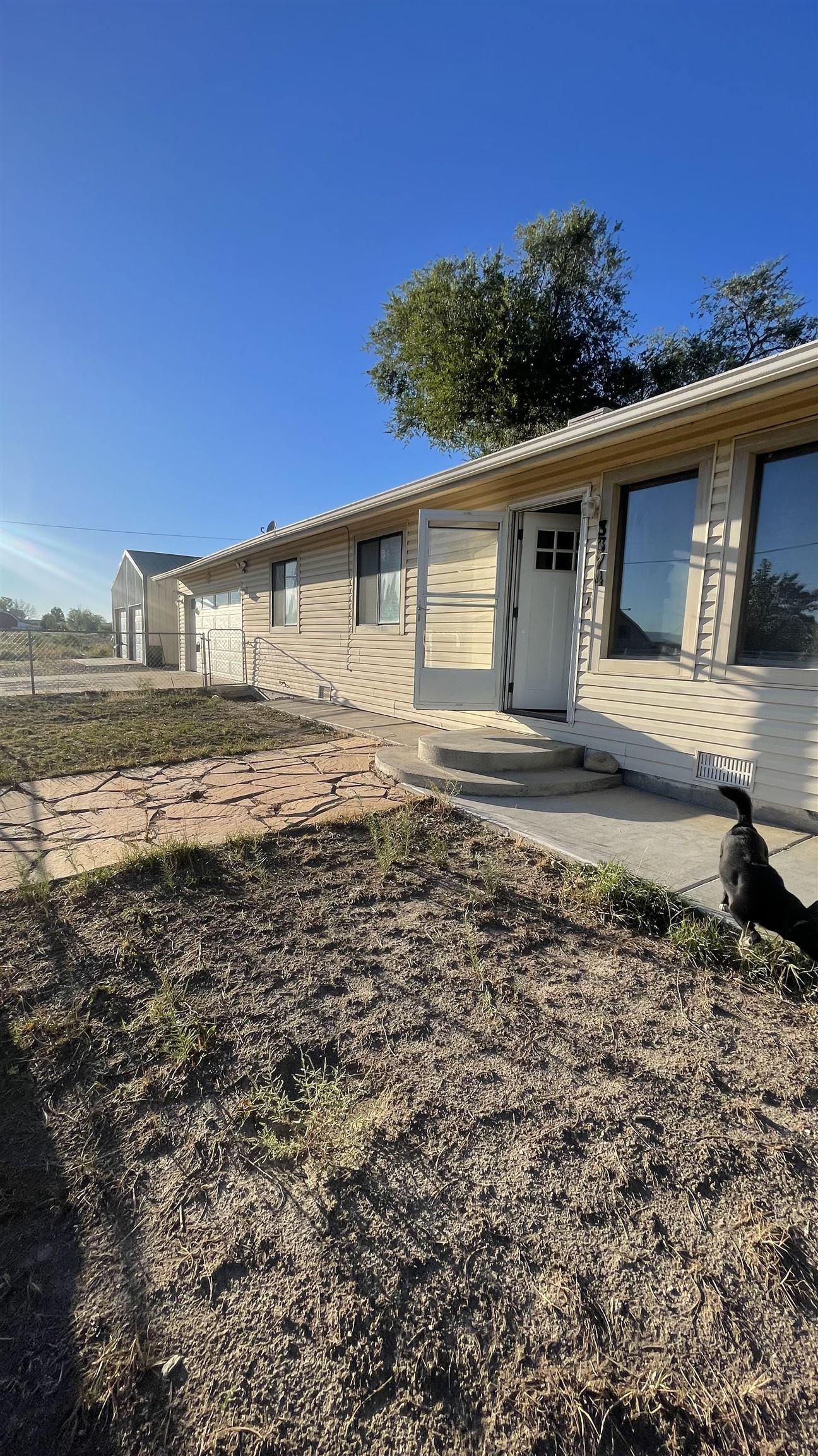 3374 G Road Clifton, CO 81520 - Photo 24 of 24 a front view of a house with a yard