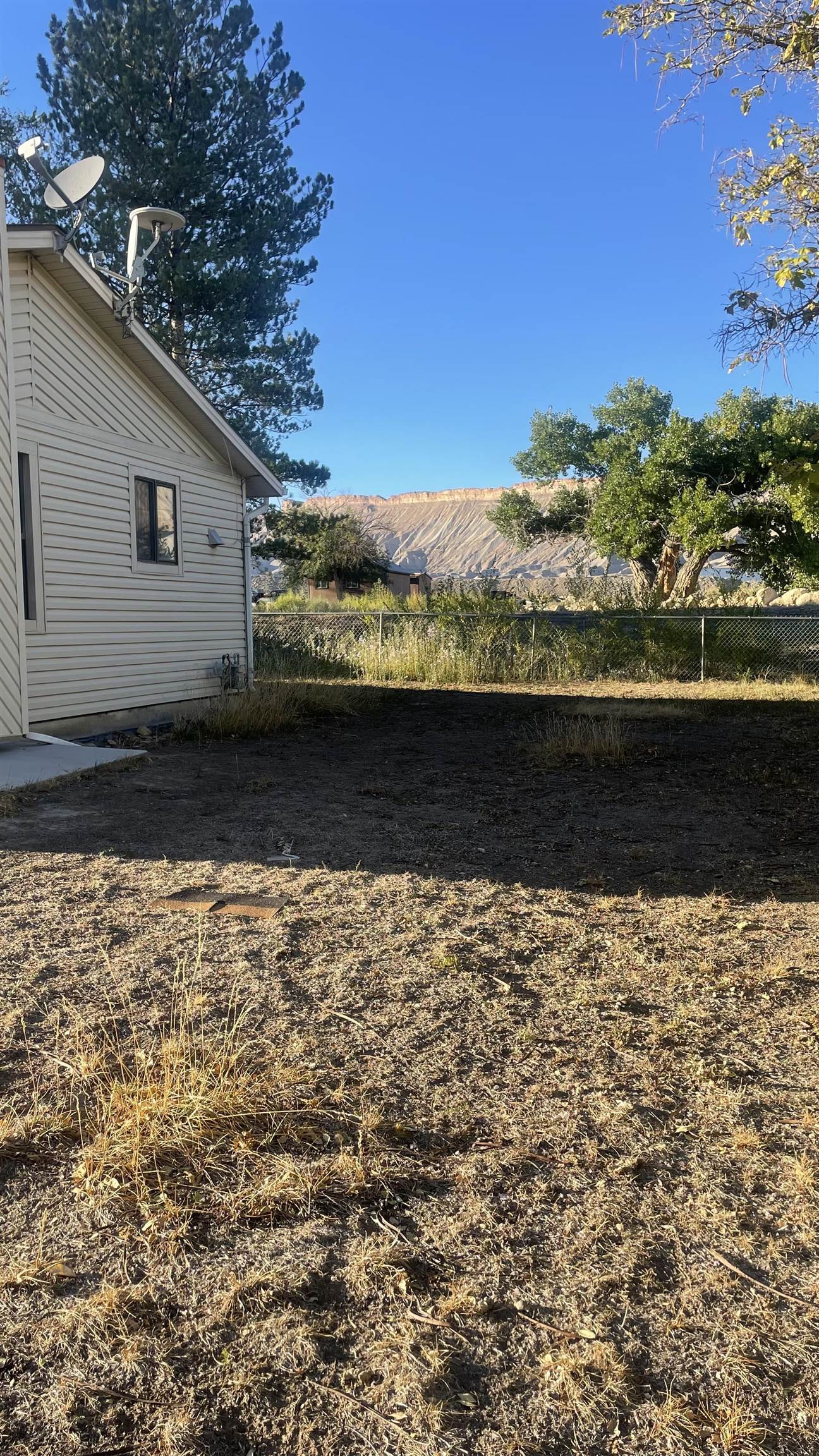 3374 G Road Clifton, CO 81520 - Photo 6 of 24 a view of a backyard of the house