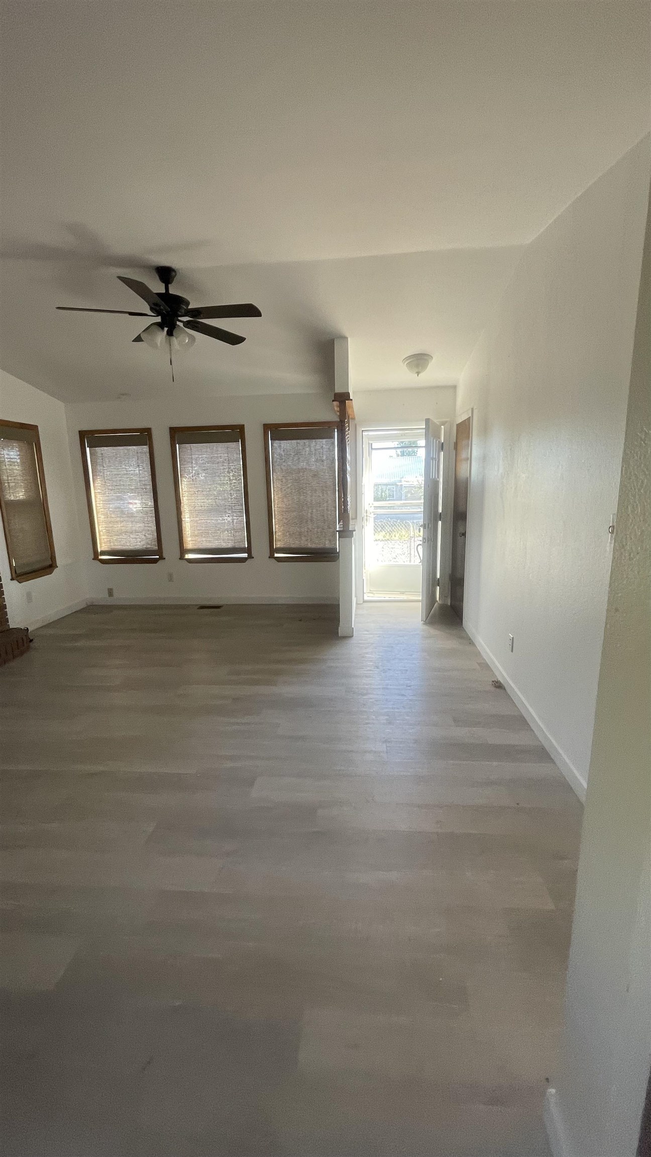 3374 G Road Clifton, CO 81520 - Photo 10 of 24 wooden floor in an empty room with a window