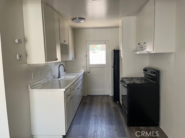 73740 Santa Rosa Way, Unit 5 Palm Desert, CA 92260 - Photo 11 of 20 a kitchen with a sink stove and refrigerator