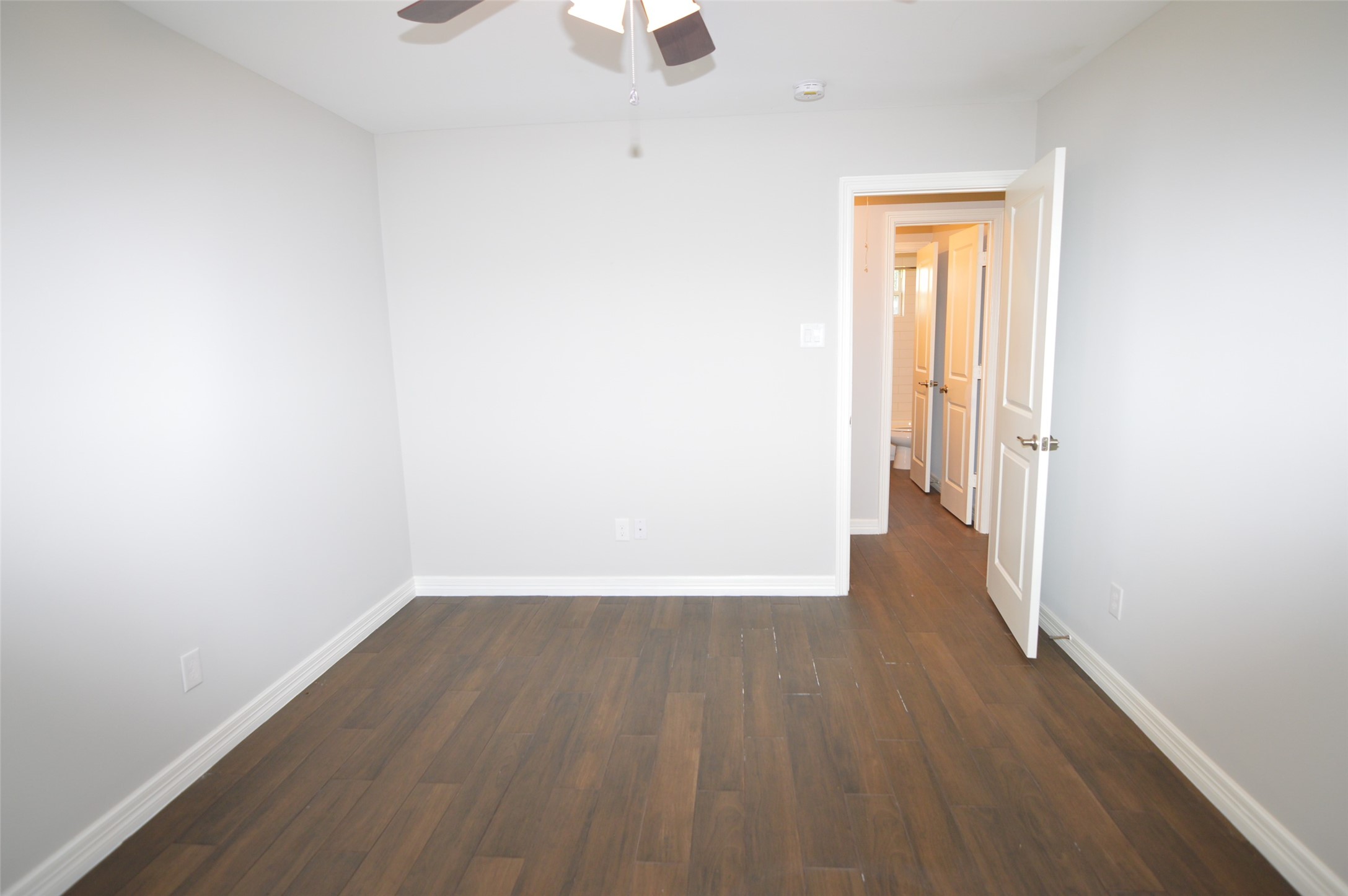 10002 Neuens Road, Unit 2 Houston, TX 77080 - Photo 11 of 15 a view of a small space with wooden floor and a window