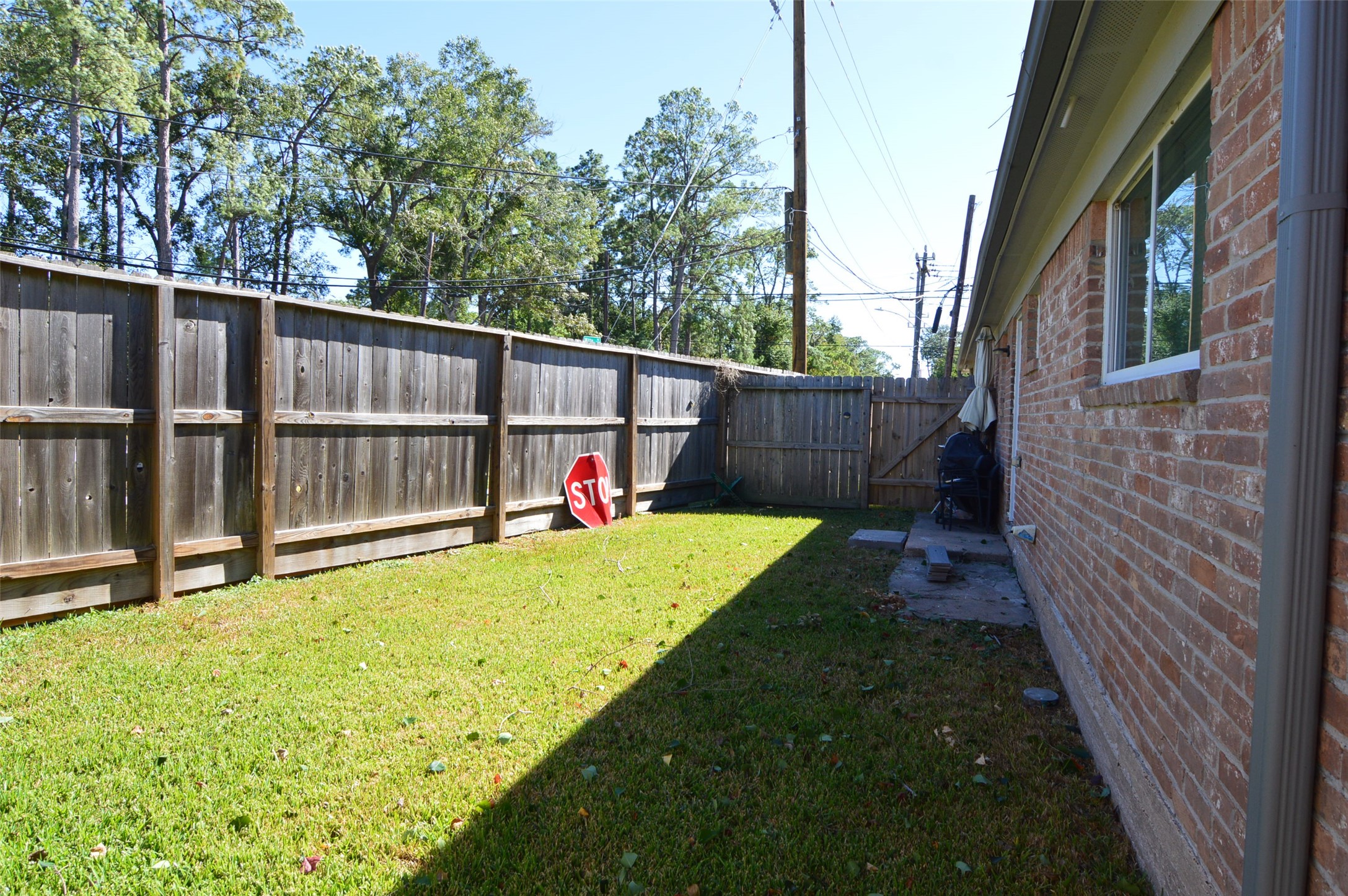 10002 Neuens Road, Unit 2 Houston, TX 77080 - Photo 12 of 15 a view of a backyard with a garden and deck